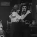 The Musketeers of Pig Alley (1912) - The Musician