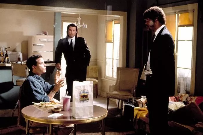 Frank Whaley (Brett), John Travolta (Vincent Vega), Samuel L. Jackson (Jules Winnfield)