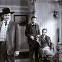 Errol Flynn (Michael J. ’Mike’ McComb), Tom D’Andrea, Barton MacLane (’Banjo’ Sweeney)