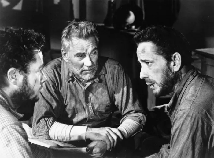 Humphrey Bogart (Fred C. Dobbs), Tim Holt (Curtin), Walter Huston (Howard) zdroj: imdb.com